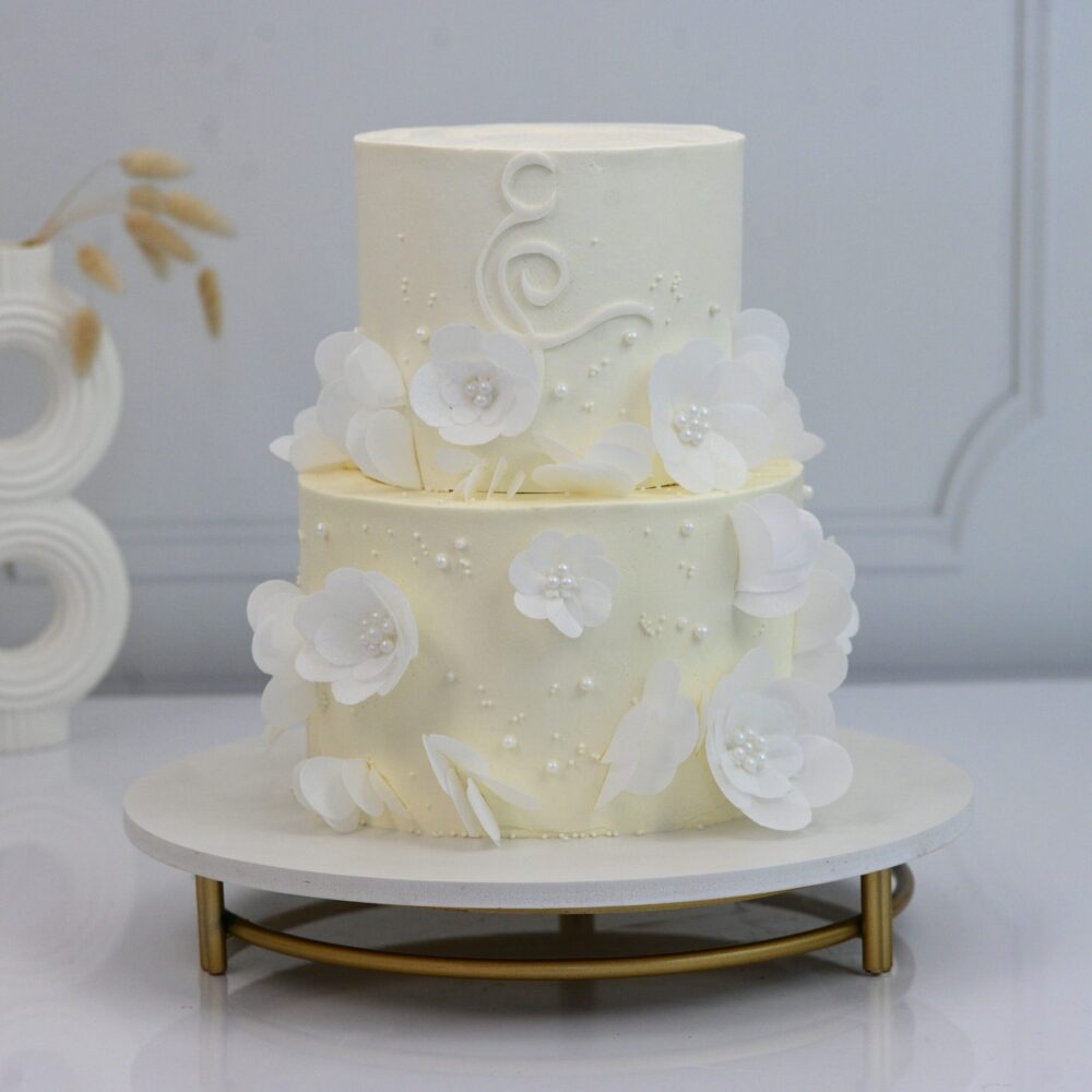 Joyful Farhah Engagement Cake, featuring intricate pearl detailing, delicate floral sugar work and a subtle shimmer.