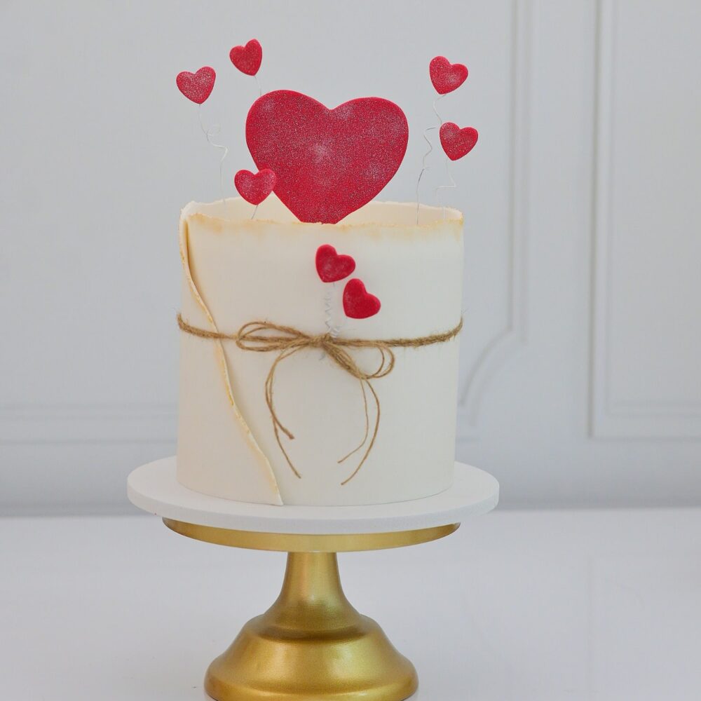 Delicious Valentine's Day cake with heart-shaped decoration, perfect for romantic celebrations - Pink Cakes Valentine's Collection.