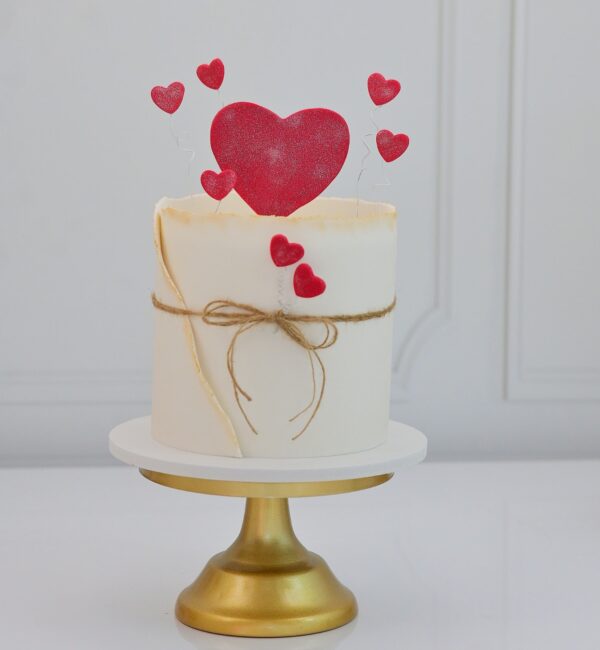 Delicious Valentine's Day cake with heart-shaped decoration, perfect for romantic celebrations - Pink Cakes Valentine's Collection.